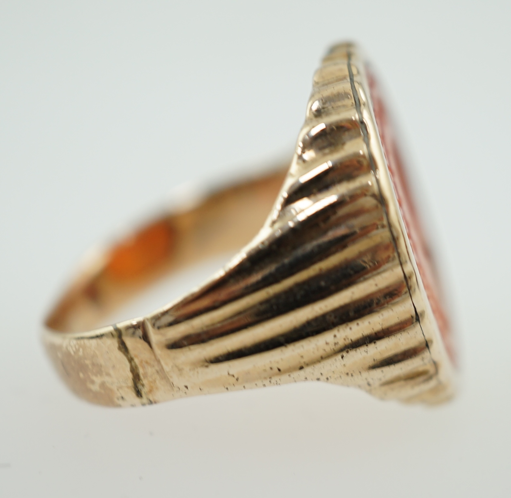 An antique Austro Hungarian gold and carnelian intaglio set oval ring, carved with the bust to dexter of Arch Duke Joseph